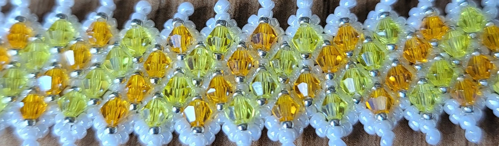 Handcrafted beaded jewellery detail showing colourful glass beadwork and artisan craftsmanship